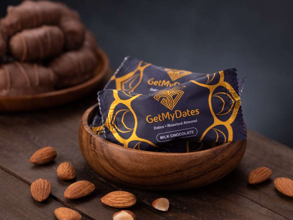 Assorted Milk Dates Chocolate filled with Golden Roasted Almond, Candied Spicy-Sweet Ginger and Tangy Orange Peel (approx. 120 gm, 8-9 pieces)