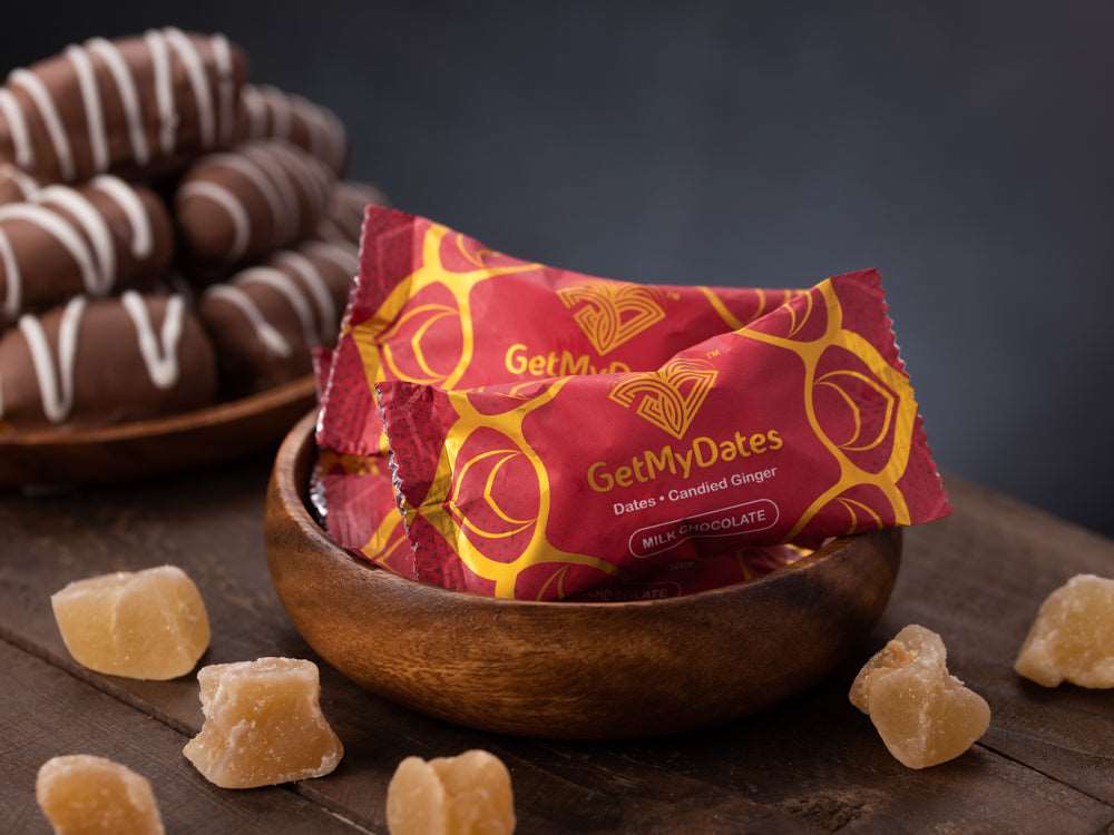Assorted Milk Dates Chocolate filled with Golden Roasted Almond, Candied Spicy-Sweet Ginger and Tangy Orange Peel (approx. 120 gm, 8-9 pieces)